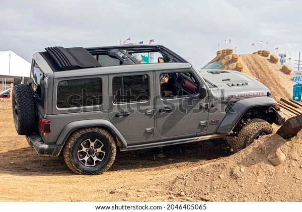 PONTIAC - SEPTEMBER 21 : The Jeep Wrangler\
Rubicon on a test course at the Motor Bella Autoshow.  September\
21, 2021 in Pontiac,\
Michigan