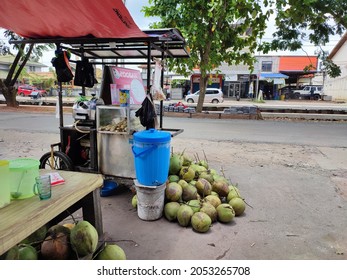 Pontianak, Indonesia - 06 October 2021 : street food and drink, cart selling sugar cane and coconut water on the side of the road