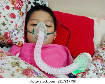 Pontianak Indonesia, October 23, 2022, A Child Is Sleeping Using A Nebulizer Tube To Ease His Breathing Due To An Asthma Problem 