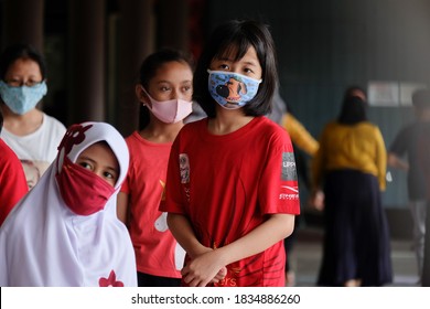 PONTIANAK, WEST KALIMANTAN, INDONESIA - September 2020 : New Normal Activities In Public Space. Kids With Face Masks. Stay Active By Implementing Health Protocols