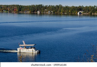 Pontoon Boat On A Blue Lake