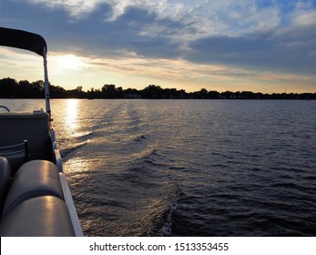 Pontoon on Lake Lansing During Sunset