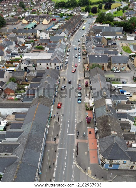 Pontyclun, Wales\
- July 2022: Aerial view of the main street of shops which runs\
through the centre of the\
village.