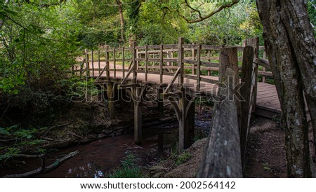 Pooh Sticks bridge were Pooh sticks originated located in the One Hundred Acre wood in Ashdown Forest near Hartfield.