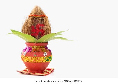 Pooja Kalash On Red Asan Decorated With Coconut, Mango Leaf Used In Navratri Pooja, Dussehra Puja, Karva Chauth, Teej, Ganesh Chaturthi Or Shubh Deepavali. Isolated On White Background With Copy Space - Shutterstock ID 2057530832