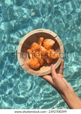 pool aesthetic oranges wooden bowl water background