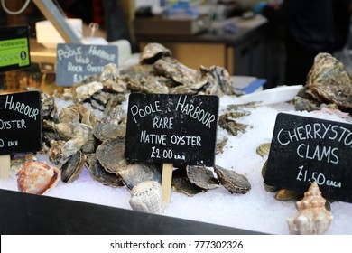 Pool arbour rare native oysters and cherrystone clams on ice at the Borough Market in London.