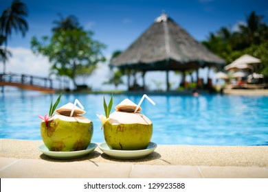 pool with artificial beach and tropical ocean