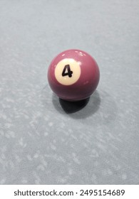 Pool balls on gray table sport game set known as eight ball pool. Number four.
