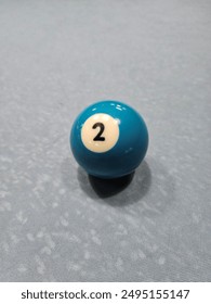 Pool balls on gray table sport game set known as eight ball pool. Number  two.