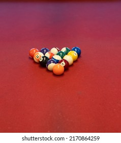 Pool Balls On Red Felt Billiard Table