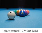 pool balls on a table, white ball close-up	