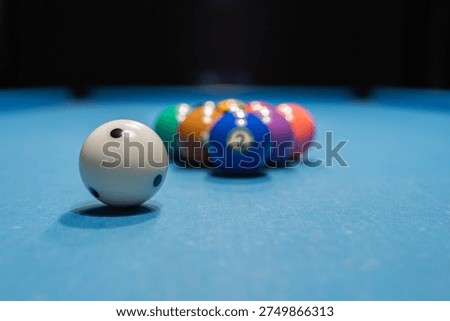 pool balls on a table, white ball close-up	