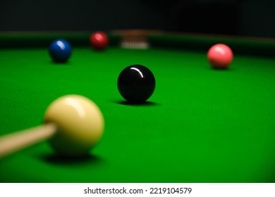 Pool, Billiard, Snooker Balls From A Low Angle On Soft Green Textured Table. For A Dynamic Design Element On A Wallpaper, Background, Banner, Poster At A Party, Club, Bar Or Pub.