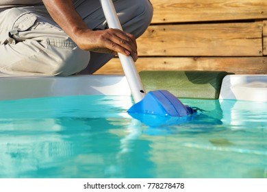Pool cleaner during his work. - Shutterstock ID 778278478