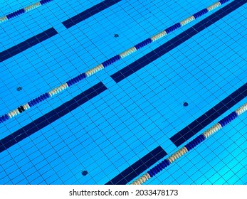 Pool With Clear Water And Blue Color Tinted Tiles. Detail With No People