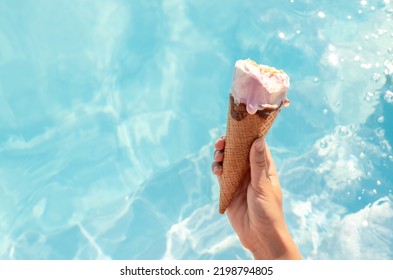  pool day teenager have fun.girl hold bitten ice cream cone,candy lollipop on stick or heart shape from hands.clean water pool background.vacation sea time concept.tasty delicious sweets.love girl - Powered by Shutterstock