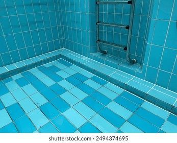 The pool is dirty, the empty dry pool is getting ready to be filled.