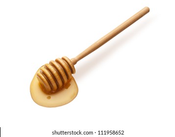 A Pool Of Honey From A Wooden Stick Isolated On White Background.