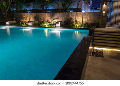 Pool Lighting In Backyard At Night For Family Lifestyle And Living Area.  Luxury Design With Good Light And Clean Landscaping.