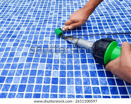 Pool liner working. Plastic Welding Machine. Welding plastic coverings for pool.Vinyl cloth welding.Welding of vinyl cloth for pool. Waterproofing and lining the inner surface of the pool bowl. 