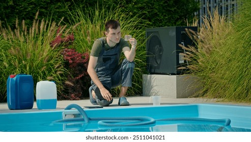 Pool maintenance technician analyzing water sample beside a swimming pool surrounded by greenery and chemical containers. - Powered by Shutterstock