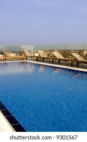 Pool On Top Of A Hotel Roof Overlooking The City