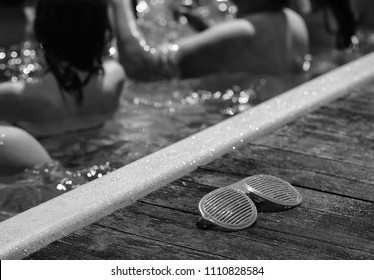 Pool Party. Funny Shutter Shading Sunglasses Of Orange Color Extravagant Party Goggles Retro Style Near Swimming Pool With People