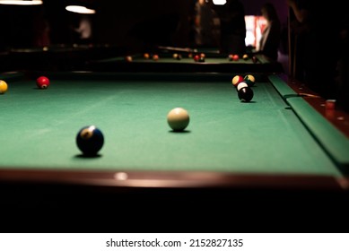 Pool Table. Balls On The Pool Table During The Match. Party Game With A Drill At The Bar.