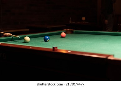 Pool Table. Balls On The Pool Table During The Match. Party Game With A Drill At The Bar.