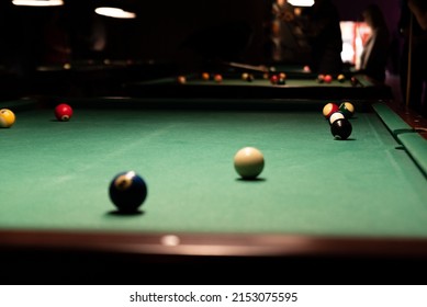 Pool Table. Balls On The Pool Table During The Match. Party Game With A Drill At The Bar.