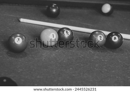 pool table with billiard balls in black and white
