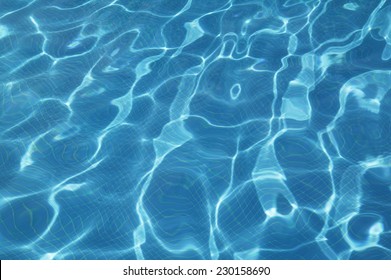 Pool water reflection in blue tone. Horizontal format