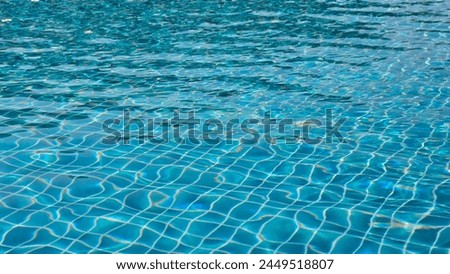 pool water under the sunlight with blue mosaic, swimming pool surface