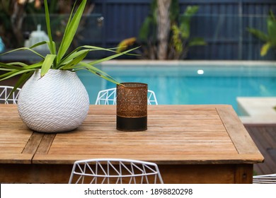 Poolside Decor With Plants And Outdoor Dining