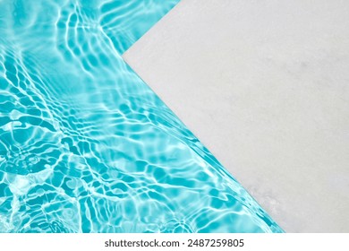 Poolside Serenity. A serene poolside scene with clear, rippling turquoise water