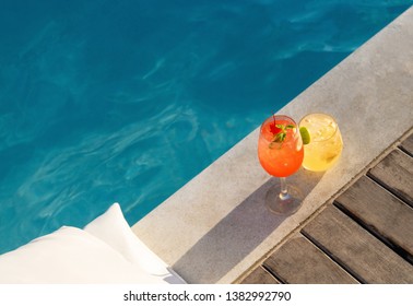 Poolside Symmetric Cocktails Served Cold At Pool Bar With Signature Drink