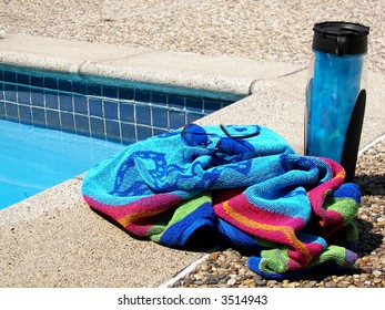Poolside towel and drink