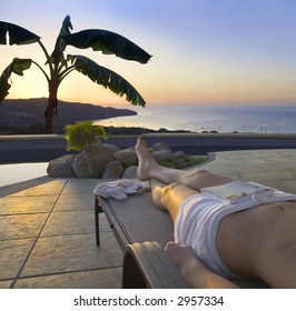 Poolside view of the sun setting over the ocean in Costa Rica