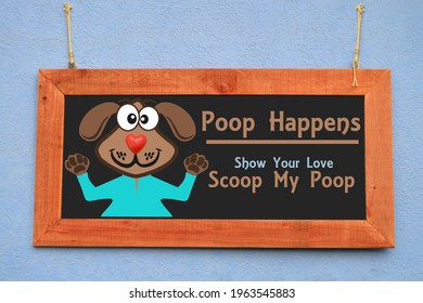 Poop Happens sign (Scoop My Poop) Blackboard sign hanging on exterior wall
