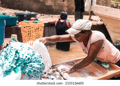 Poor Black Woman Washing Clothes In A River In A Poor Community In The North Caribbean Of Nicaragua.