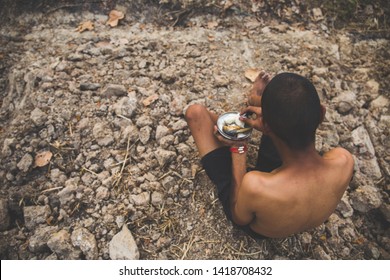 Poor Child Or Beggar Begging You For Help Sitting At Dirty Slum. Concept For Poverty Or Hunger People,human Rights,donate And Charity For Underprivileged Children In Third World