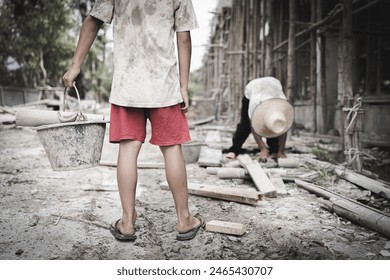  Poor children are forced to work in construction. are forced to work in the construction area. Human rights concepts, stopping child abuse, violence, fear of child labor and human trafficking.