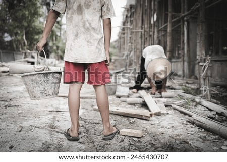  Poor children are forced to work in construction. are forced to work in the construction area. Human rights concepts, stopping child abuse, violence, fear of child labor and human trafficking.