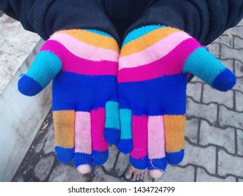 Poor Child's Torn Gloves In Winter