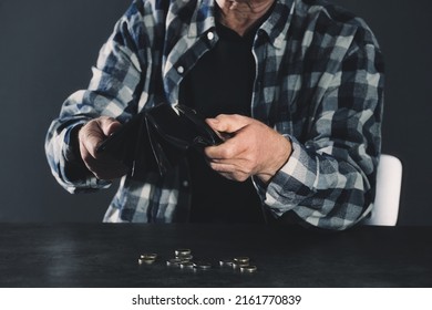 Poor Elderly Man With Empty Wallet And Coins At Table, Closeup