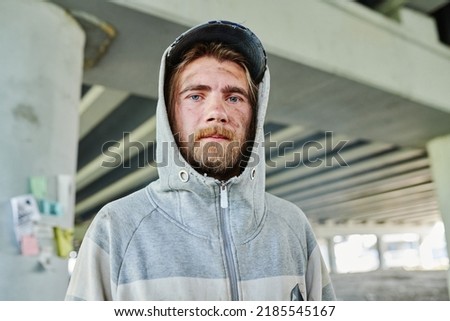 Poor homeless young man outdoors