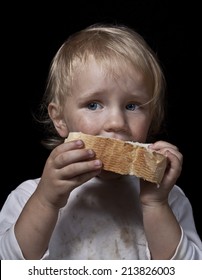 Poor Hungry Child Eating Bread