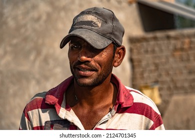 A Poor Laborer Working Hard In Extreme Heat On A Construction Site