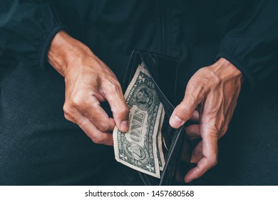 Poor Man Hand Open Wallet With One US Dollar